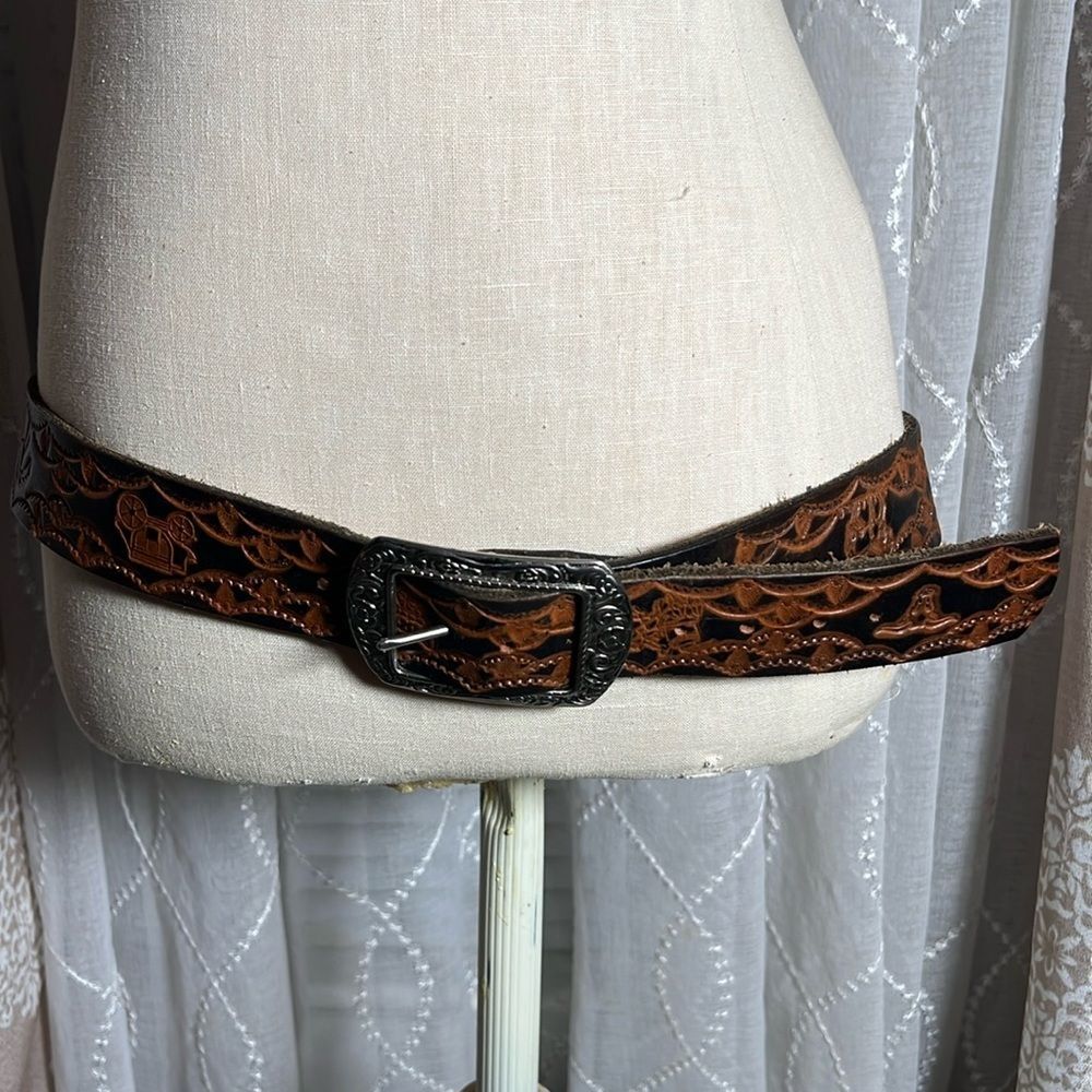 Brown leather belt with metal buckle